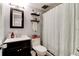 Clean bathroom with dark vanity, shower/tub combo and updated fixtures at 2801 N Halifax Ave # 143, Daytona Beach, FL 32118