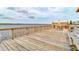 Spacious wooden dock with seating and river views at 2801 N Halifax Ave # 143, Daytona Beach, FL 32118