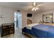 Primary bedroom with ample space, featuring a comfortable bed and a view of the hallway at 2801 N Halifax Ave # 143, Daytona Beach, FL 32118