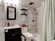 Updated bathroom with a walk-in shower, floating shelves, and stylish decor at 2801 N Halifax Ave # 143, Daytona Beach, FL 32118