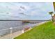 Scenic waterfront walkway with a bench, offering peaceful views at 2801 N Halifax Ave # 143, Daytona Beach, FL 32118