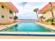 Refreshing community pool with lounge chairs and waterfront views at 2801 N Halifax Ave # 143, Daytona Beach, FL 32118