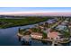 Waterfront property with canal access at sunset at 138 Old Carriage Rd, Ponce Inlet, FL 32127