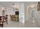Kitchen with granite island, white cabinets, and black appliances at 138 Old Carriage Rd, Ponce Inlet, FL 32127