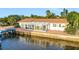 Bright waterfront home with a sunroom and dock at 138 Old Carriage Rd, Ponce Inlet, FL 32127
