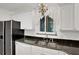 Kitchen features granite countertops and white cabinets at 138 Old Carriage Rd, Ponce Inlet, FL 32127