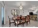 Elegant dining room with a large wooden table and crystal chandelier at 138 Old Carriage Rd, Ponce Inlet, FL 32127