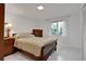Bedroom with a queen-size bed and wood furniture at 138 Old Carriage Rd, Ponce Inlet, FL 32127