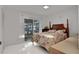 Bedroom with water view and sliding glass doors at 138 Old Carriage Rd, Ponce Inlet, FL 32127