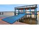 Covered boat lift, offering protection and easy access at 138 Old Carriage Rd, Ponce Inlet, FL 32127