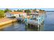 Elevated boat lift and waterfront home at 138 Old Carriage Rd, Ponce Inlet, FL 32127