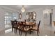 Elegant dining room with water views and chandelier at 138 Old Carriage Rd, Ponce Inlet, FL 32127
