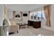 Bright living room with water view, comfy seating, and a large desk at 138 Old Carriage Rd, Ponce Inlet, FL 32127