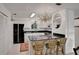 Modern kitchen with granite countertops and white cabinets at 138 Old Carriage Rd, Ponce Inlet, FL 32127