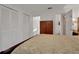 Bedroom with double bed, mirrored dresser, and built-in closets at 138 Old Carriage Rd, Ponce Inlet, FL 32127