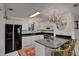 Modern kitchen with granite countertops and white cabinets at 138 Old Carriage Rd, Ponce Inlet, FL 32127