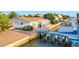 Waterfront home with a dock and sunroom at 138 Old Carriage Rd, Ponce Inlet, FL 32127