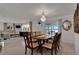 Spacious dining room with water views and chandelier at 138 Old Carriage Rd, Ponce Inlet, FL 32127