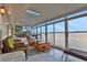 Sunroom with water views and comfortable seating at 138 Old Carriage Rd, Ponce Inlet, FL 32127