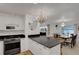 Modern kitchen with granite countertops and white cabinets at 138 Old Carriage Rd, Ponce Inlet, FL 32127