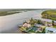 Wide aerial view of waterfront home and neighborhood at 138 Old Carriage Rd, Ponce Inlet, FL 32127