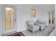 Relaxing porch with white wicker chairs and a stained glass door at 138 Old Carriage Rd, Ponce Inlet, FL 32127