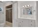 Bathroom with a shower/tub combo and white vanity at 138 Old Carriage Rd, Ponce Inlet, FL 32127