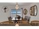 Bright dining room with water views and chandelier at 138 Old Carriage Rd, Ponce Inlet, FL 32127