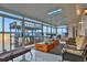 Sunroom with water views and a telescope at 138 Old Carriage Rd, Ponce Inlet, FL 32127