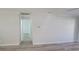Bright hallway with light gray walls and wood-look floors at 217 N Hill Ave # 20, Deland, FL 32724