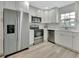 Modern kitchen with stainless steel appliances and white cabinets at 217 N Hill Ave # 20, Deland, FL 32724