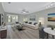 Bright living room with comfy seating and a large window at 217 N Hill Ave # 20, Deland, FL 32724