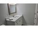 Bathroom with vanity, mirror, and white cabinets at 217 N Hill Ave # 20, Deland, FL 32724