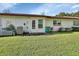 Private backyard with spacious grassy area and patio at 217 N Hill Ave # 20, Deland, FL 32724