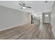 Open concept living room and kitchen with hardwood floors at 217 N Hill Ave # 20, Deland, FL 32724
