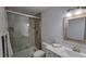 Modern bathroom with a walk-in shower, toilet, and vanity at 217 N Hill Ave # 20, Deland, FL 32724