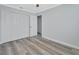Spacious bedroom with ample closet space and wood-look floors at 217 N Hill Ave # 20, Deland, FL 32724