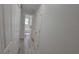 Hallway with light grey walls and wood-look flooring at 217 N Hill Ave # 20, Deland, FL 32724