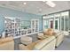 Relaxing common area with comfortable seating and bookshelves at 241 Riverside Dr # 2205, Holly Hill, FL 32117