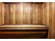 Simple sauna room with wooden walls and bench at 2700 Ocean Shore Blvd # 111, Ormond Beach, FL 32176
