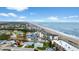 Aerial view showcasing beachfront building and coastal landscape at 2700 Ocean Shore Blvd # 111, Ormond Beach, FL 32176