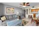 Bright living room with comfy seating, a coffee table, and a view into the kitchen at 2700 Ocean Shore Blvd # 111, Ormond Beach, FL 32176