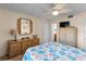 Bedroom with a dresser, mirror, and a queen-size bed at 2700 Ocean Shore Blvd # 111, Ormond Beach, FL 32176