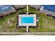Overhead view of refreshing community pool with lounge chairs at 2700 Ocean Shore Blvd # 111, Ormond Beach, FL 32176
