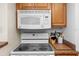 Close-up view of the kitchen's electric cooktop and microwave at 2700 Ocean Shore Blvd # 111, Ormond Beach, FL 32176