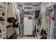Spacious walk-in closet with custom shelving and drawers at 4672 Riverwalk Village Ct # 8201, Ponce Inlet, FL 32127