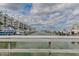Stunning view of the marina with boats docked and waterfront buildings at 4672 Riverwalk Village Ct # 8201, Ponce Inlet, FL 32127
