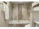 Spa-like bathroom with soaking tub and marble tile surround at 4672 Riverwalk Village Ct # 8201, Ponce Inlet, FL 32127