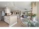 Open concept kitchen with breakfast bar and view into living area at 4672 Riverwalk Village Ct # 8201, Ponce Inlet, FL 32127