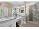 Elegant bathroom with double sinks, marble shower, and modern fixtures at 4672 Riverwalk Village Ct # 8201, Ponce Inlet, FL 32127